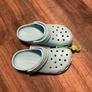 New with tags, turquoise crocs, ladies, size 7, men’s size 5